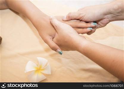 woman relaxing with hand massage at beauty spa. Close-up