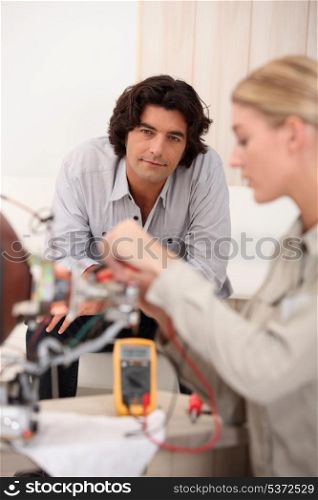 Woman repairing computer