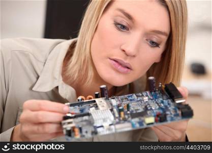 woman repairing pc
