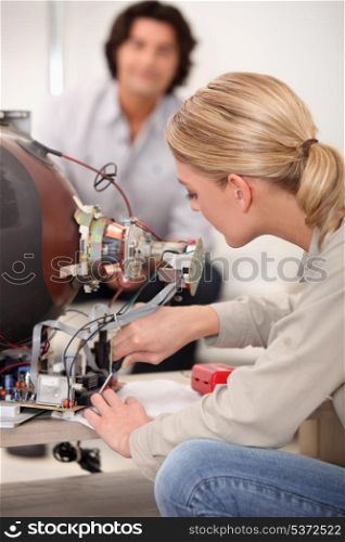 Woman repairing television