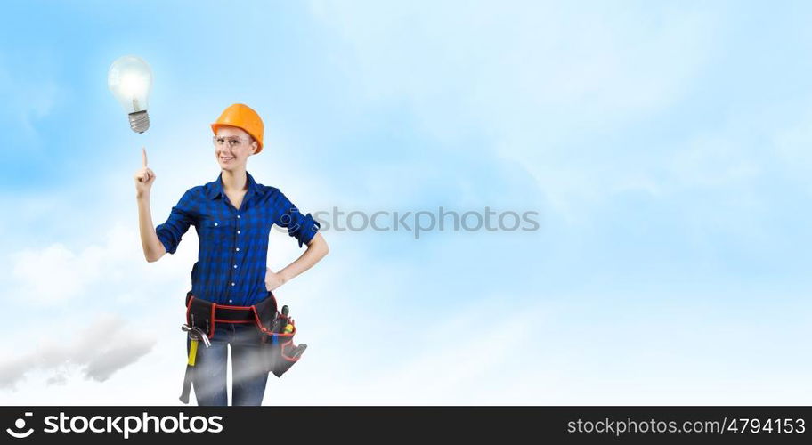 Woman repairman. Young woman handyman pointing at electrical bulb