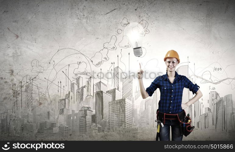 Woman repairman. Young woman handyman pointing at electrical bulb