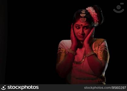 Woman representing fear with Hamsapaksha mudra