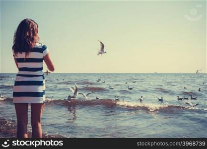 Woman restin on beach.. Relaxation and leisure. Attractive mid aged woman resting on beach. Female tourist relax near to water place on nature.
