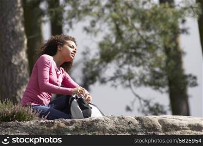Woman Resting During Countryside Hike