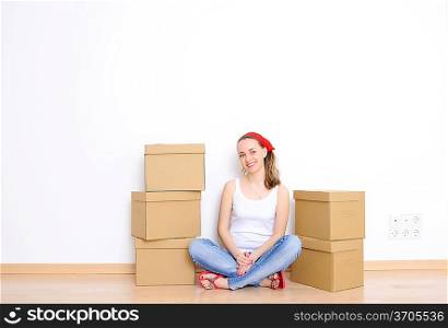 Woman resting from moving into a new home. Great copy space.