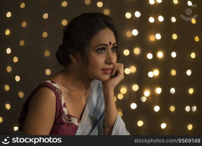 Woman resting her face on her hand intensly looking. 