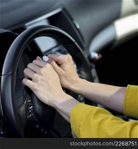 woman resting her hands steering wheel