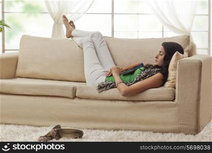 Woman resting on a sofa