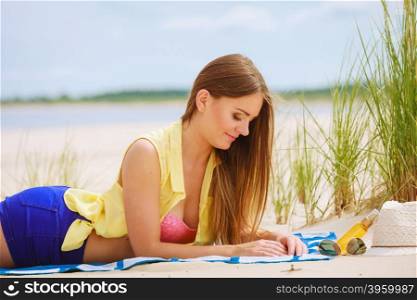 Woman resting on beach.. Relax and leisure. Young woman resting on summer beach. Pretty girl sunbathing on fresh air in summer.