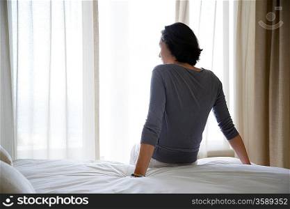 Woman Resting on Bed