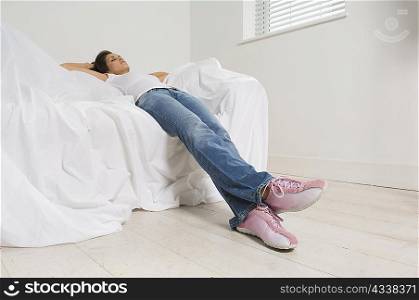 Woman resting on couch in new home