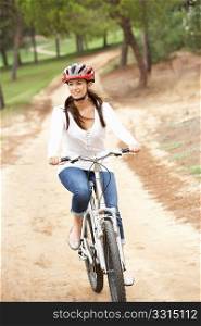 Woman riding bicycle in park