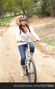 Woman riding bicycle in park
