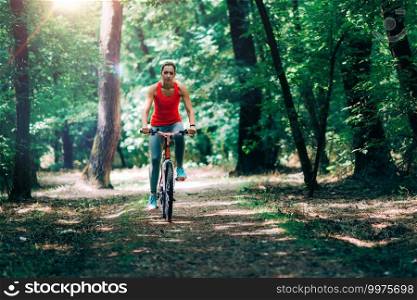 Woman Riding Bike in Park