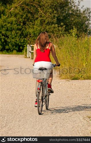 Woman riding her bicycle on a nice summer day