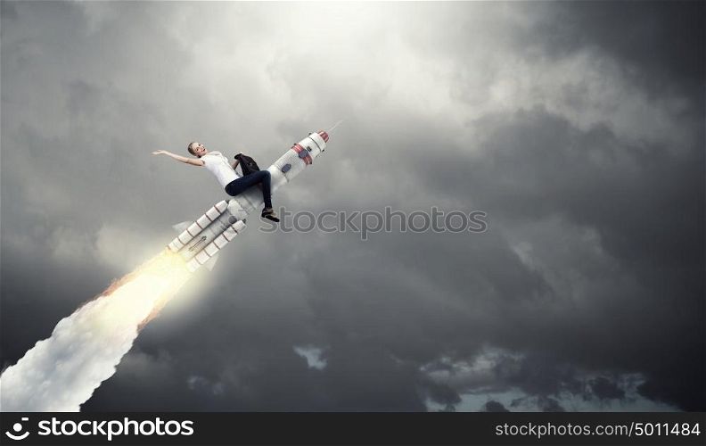 Woman riding missile. Young businesswoman flying in sky on space rocket