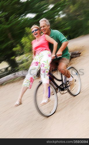 Woman Riding on Handlebars of Man&acute;s Bike