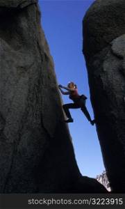 Woman Rock Climbing at buttermilks, CA