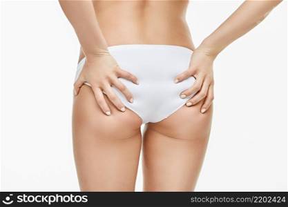 woman&rsquo;s booty close-up isolated on white background.. woman&rsquo;s booty close-up isolated on white background