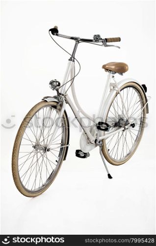 Woman&rsquo;s classic bicycle on an isolated white studio background