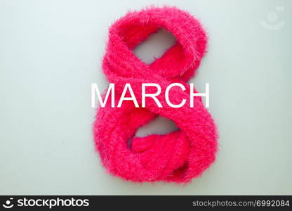 Woman&rsquo;s Day concept. Eight number made from pink scarf. 8th March