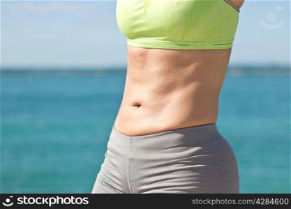 Woman&rsquo;s fit and sexy stomach
