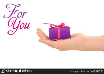 Woman&rsquo;s hand giving purple present with copyspace and text
