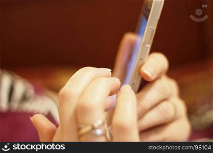 Woman's hand hold smartphone and touch a screen