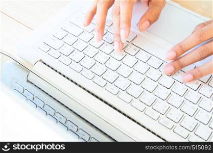 Woman's hands using laptop computer or notebook. Working at home, freelancer, online marketing. Using technology or lifestyle concept