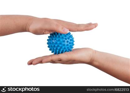 Woman&rsquo;s hands with Spiny plastic blue massage ball isolated on white background