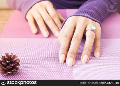 Woman&rsquo;s hands with wedding ring
