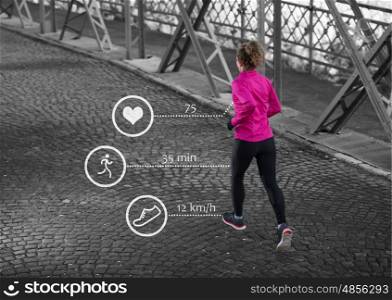 Woman running across the bridge with statistics in background