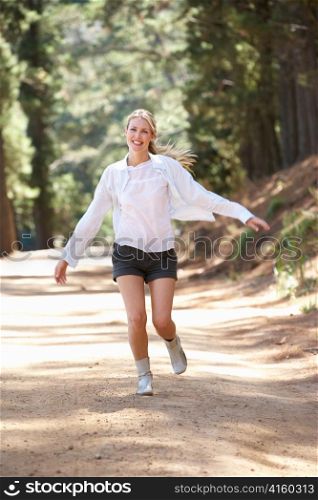 Woman running along country lane