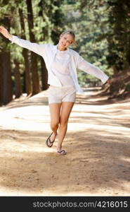 Woman running along country lane