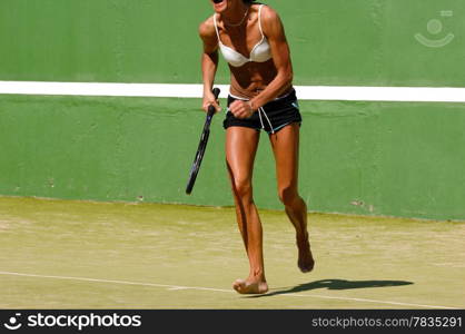 Woman running for the ball. Note that the picture is in motion blure (most the hand).