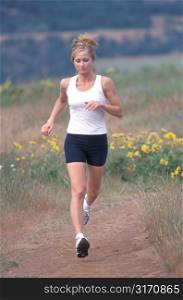 Woman Running in Field With Yellow Flowers
