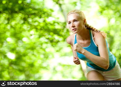 Woman Running Outdoors in Forest