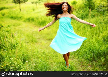 Woman running through a field