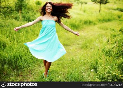 Woman running through a field
