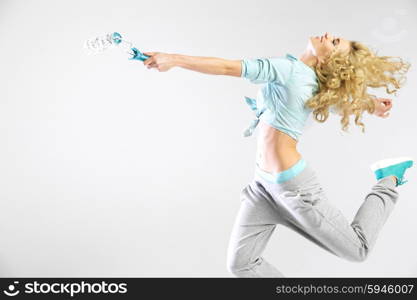 Woman running with a clean paint roller