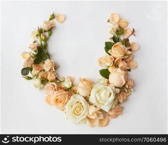 Woman’s Day concept. Beautiful decoration of background for representing as gift or present. Composition of white and yellow roses over white background.. Roses on white background