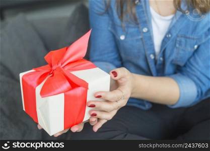 woman s hand holding gift