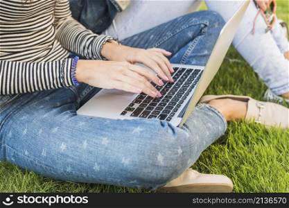 woman s hand using laptop park