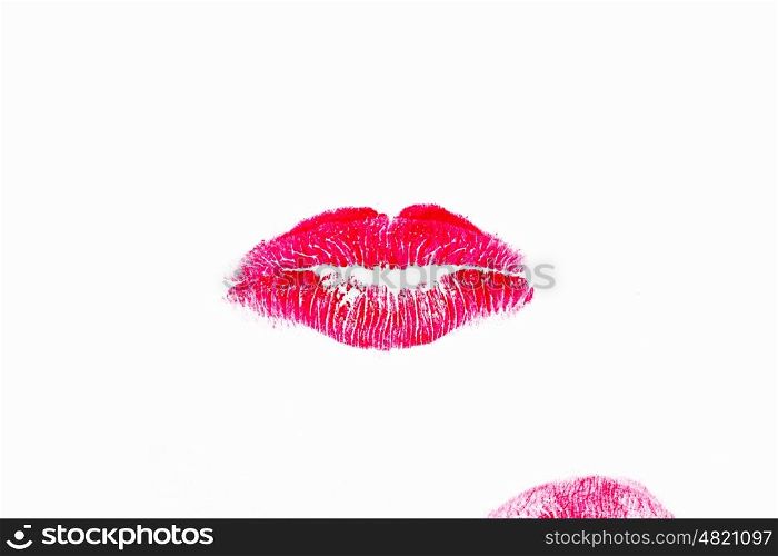 Woman's lipstick mark of kiss on white background