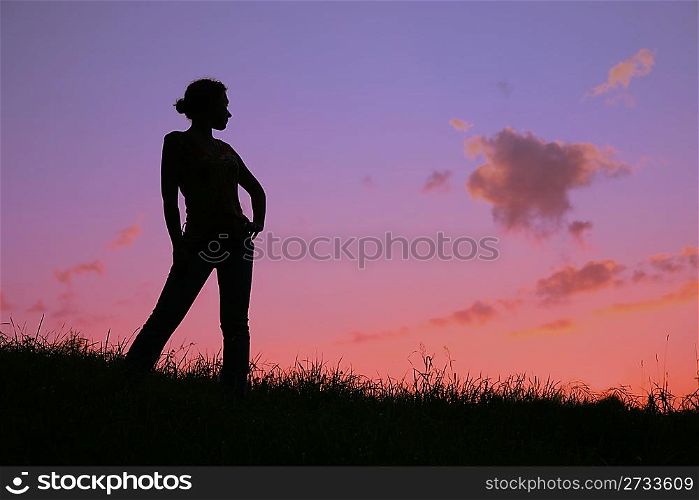 woman`s silhouette on sunset