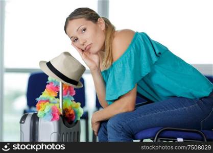 woman sat waiting at airport