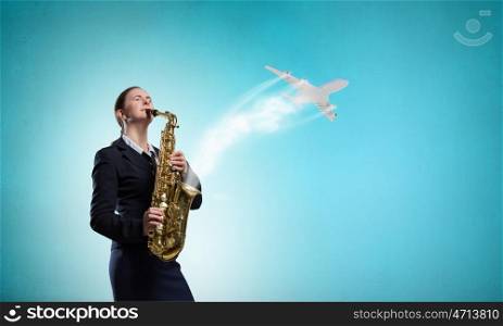 Woman saxophonist. Young pretty woman in suit playing saxophone