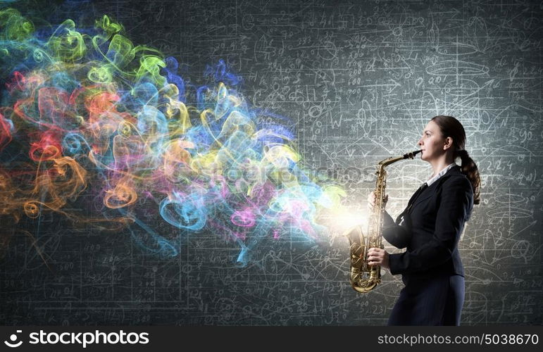 Woman saxophonist. Young pretty woman in suit playing saxophone