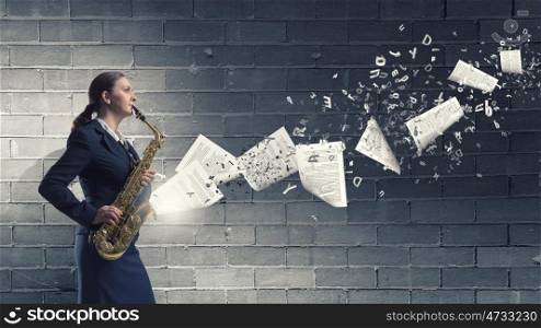 Woman saxophonist. Young woman playing saxophone and papers coming out